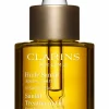 Sale Clarins Huile visage apaisante Santal